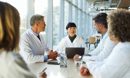 An image of a group of people discussing in a group