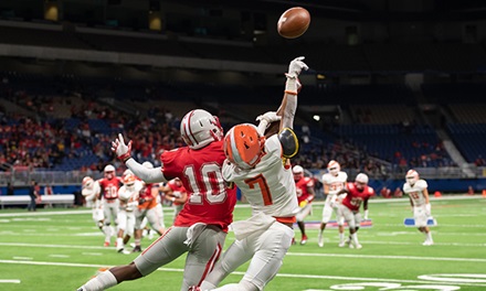 An aerial view of people playing football.