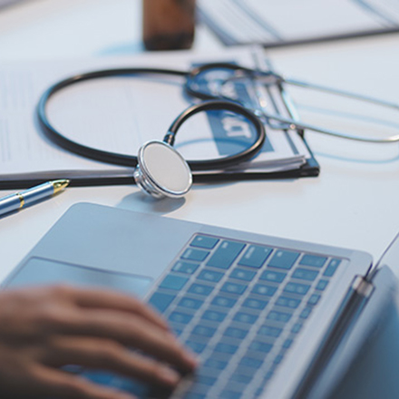 A healthcare scope image involving a stethoscope and a computer.