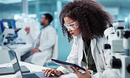 A white coat professional doing research